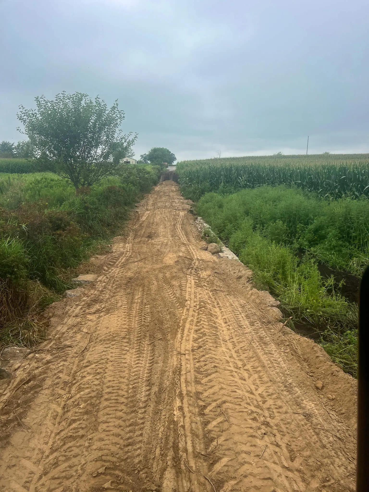 Grading a farm access lane through the field