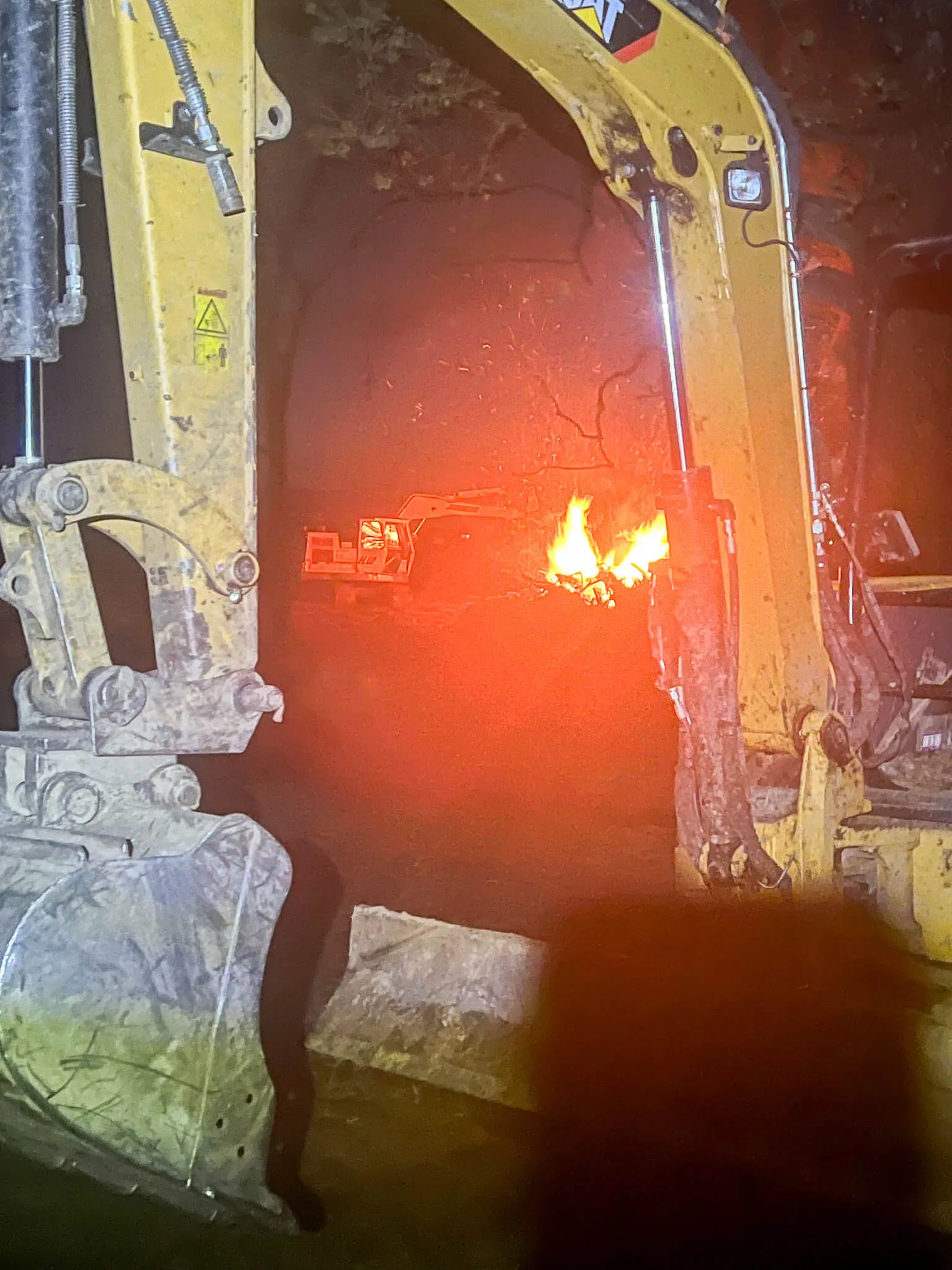 Night clearing work, burning brush and debris