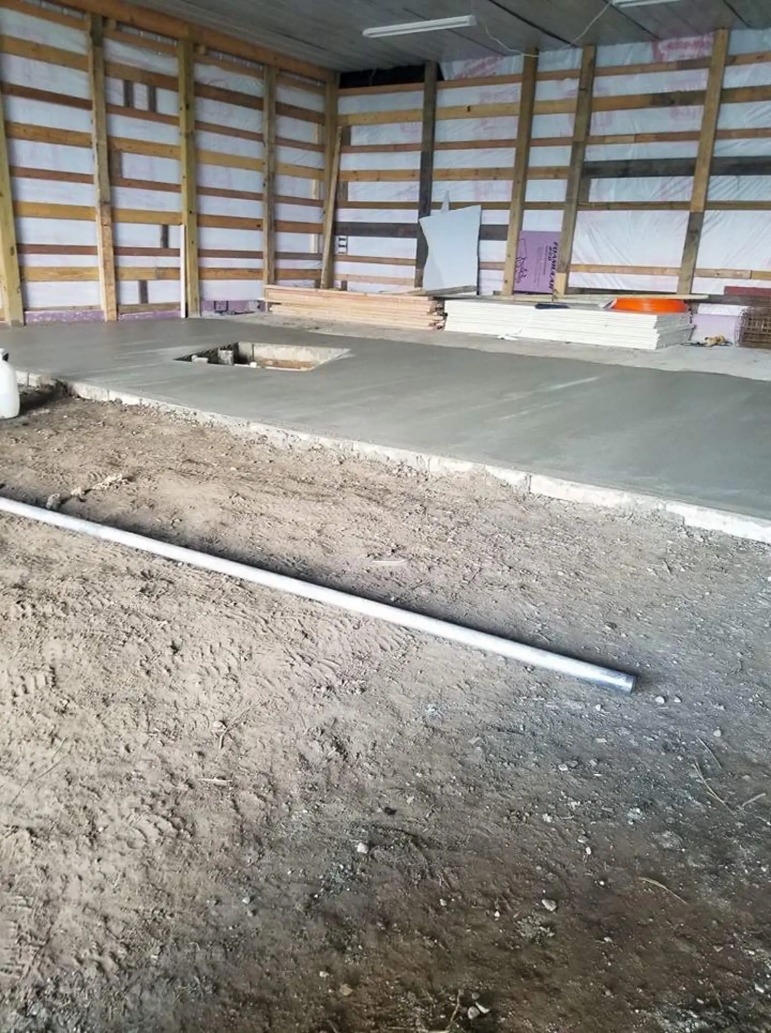 Finished concrete slab poured inside a pole barn