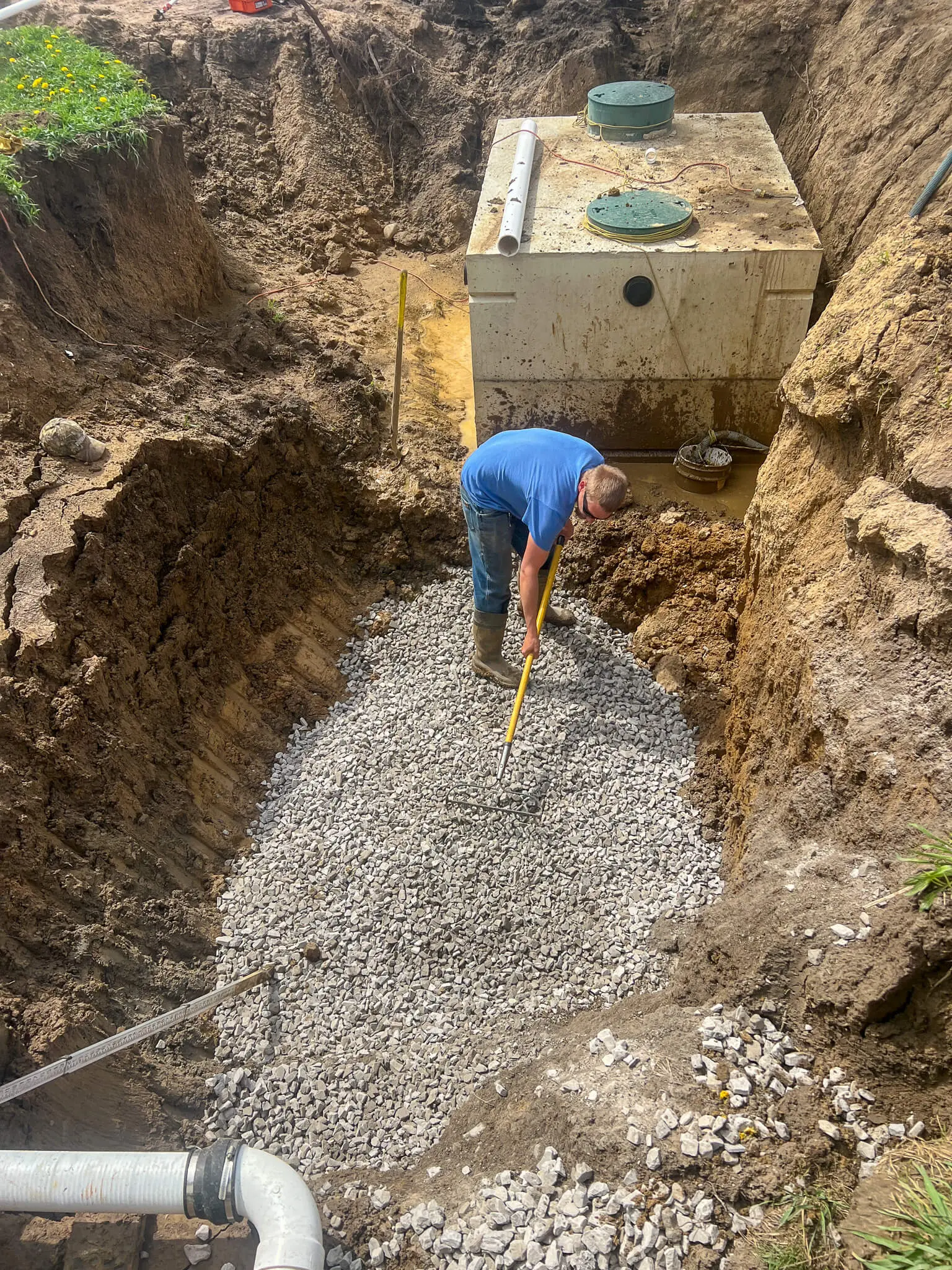 Septic tank set on a gravel bed, ready for backfill