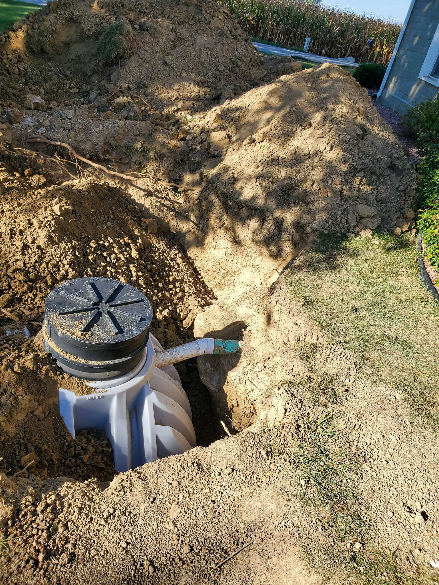 Septic tank set in the yard, ready for backfill
